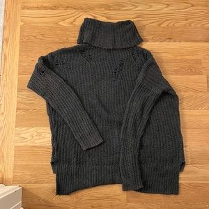 Super cute knit sweater with “rip” detailing throughout